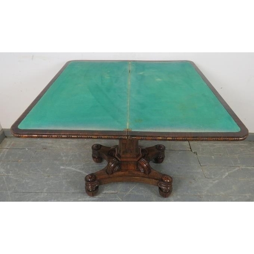 725 - A Victorian rosewood turnover card table with inset green baize, on a tapering octagonal column abov... 