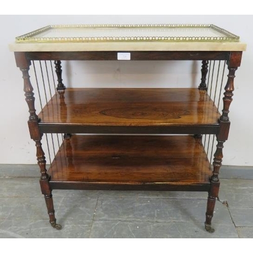 726 - A 19th century rosewood marble-topped three-tier buffet with brass gallery and side spindles, on tur... 