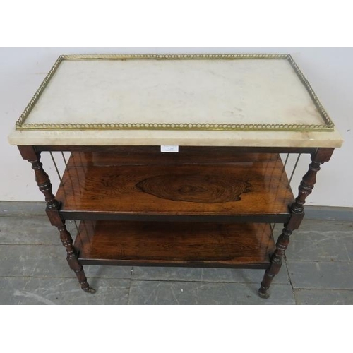 726 - A 19th century rosewood marble-topped three-tier buffet with brass gallery and side spindles, on tur... 