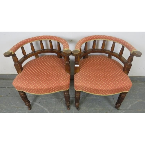 728 - A pair of 19th century oak tub chairs, upholstered in red and gold patterned material, on fluted tap... 