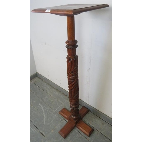 732 - A 19th century walnut torchere, the chunky relief carved column on a quatreform base.
Condition repo... 