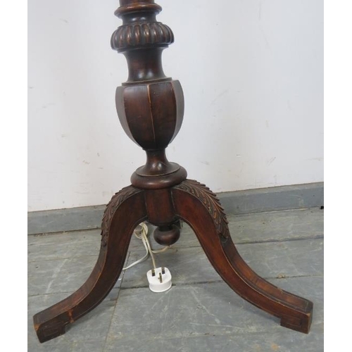 735 - An Edwardian mahogany standard lamp with carved and reeded column, on acanthus carved splayed tripod... 