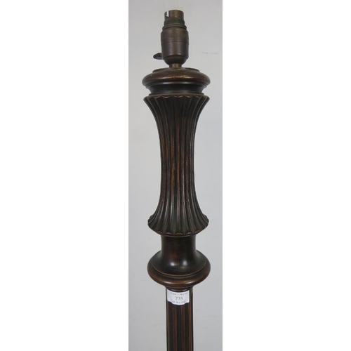 735 - An Edwardian mahogany standard lamp with carved and reeded column, on acanthus carved splayed tripod... 