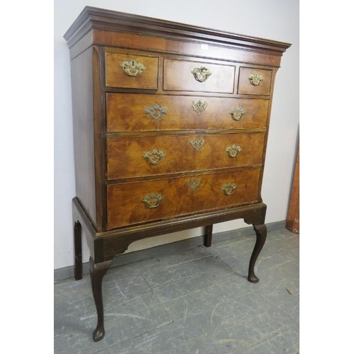 736 - A Georgian walnut chest on stand, housing three short over three long graduated cock-beaded drawers ... 