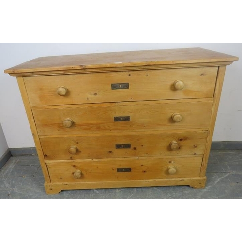 739 - An antique pine French chest of four long drawers with turned wooden knob handles, on bracket feet. ... 