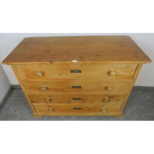 739 - An antique pine French chest of four long drawers with turned wooden knob handles, on bracket feet. ... 