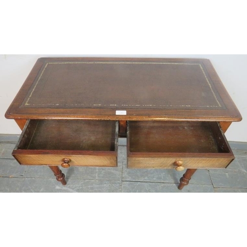 743 - A Victorian mahogany writing table, with inset brown leather surface, housing two cock-beaded short ... 