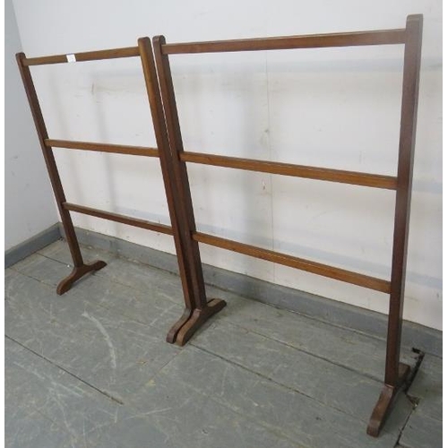 744 - A pair of Edwardian mahogany towel rails on splayed supports. 
H90cm W61cm D24cm (approx).
Condition... 