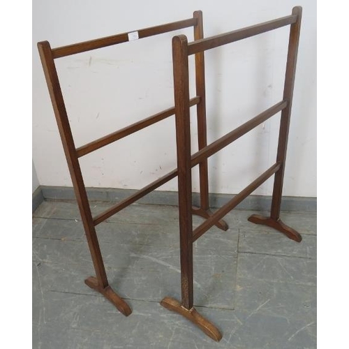 744 - A pair of Edwardian mahogany towel rails on splayed supports. 
H90cm W61cm D24cm (approx).
Condition... 