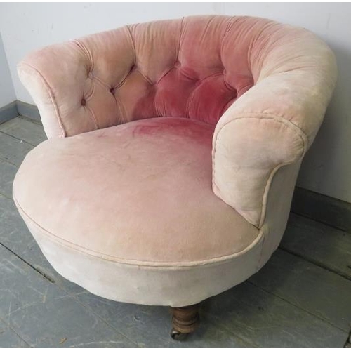 748 - A turn of the century low bedroom tub chair, upholstered in antique buttoned velvet, on turned taper... 