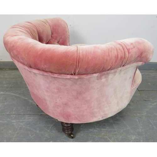 748 - A turn of the century low bedroom tub chair, upholstered in antique buttoned velvet, on turned taper... 