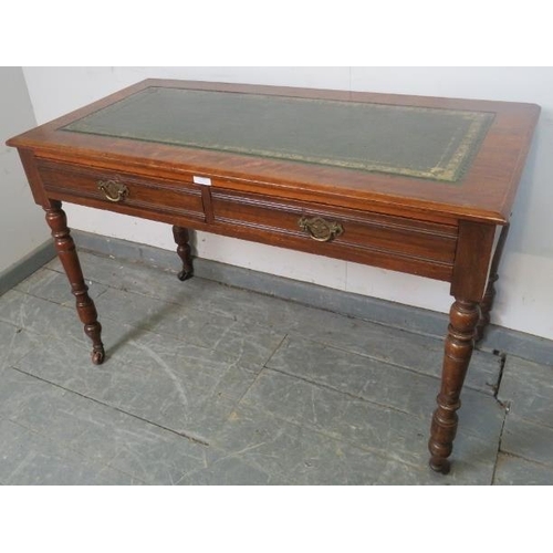 758 - An Edwardian mahogany writing table with inset gilt tooled green leather surface, housing two short ... 