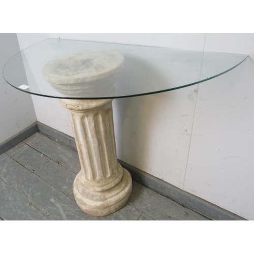 764 - A glass topped demi-lune console table, raised on a Corinthian style column base.
H72cm W100cm D51cm... 