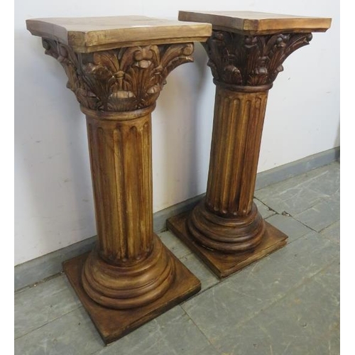 765 - A pair of plant stands in the form of Corinthian columns with acanthus carved capitols and reeded up... 