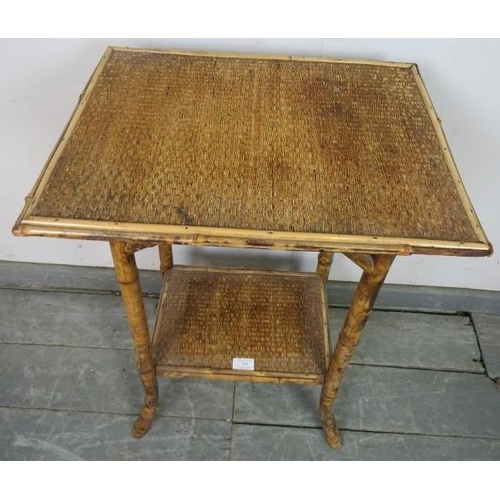 769 - A turn of the century Colonial tiger bamboo two-tier occasional table, on splayed supports. 
H71cm W... 