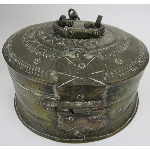 132 - A group of Middle Eastern metalware items, 19th century. Comprising a cauldron with swing handle, lo... 