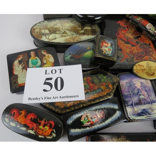 275 - Collection of thirty six Russian lacquer papier Mache boxes, hair slides, brooches, some signed. (36... 