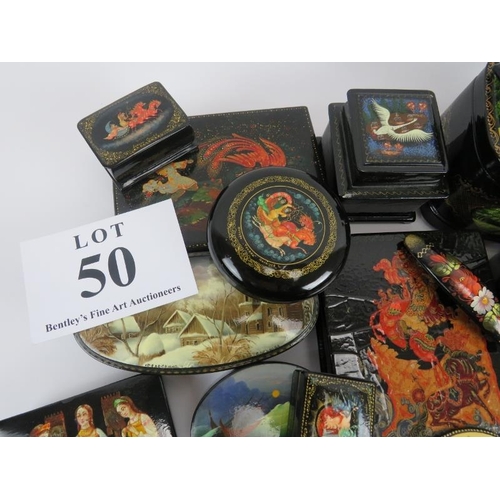 275 - Collection of thirty six Russian lacquer papier Mache boxes, hair slides, brooches, some signed. (36... 