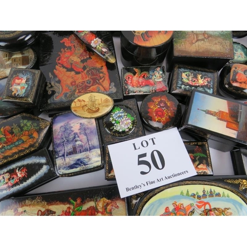 275 - Collection of thirty six Russian lacquer papier Mache boxes, hair slides, brooches, some signed. (36... 