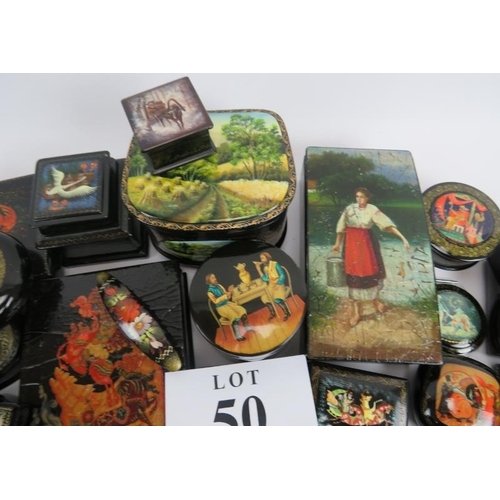 275 - Collection of thirty six Russian lacquer papier Mache boxes, hair slides, brooches, some signed. (36... 