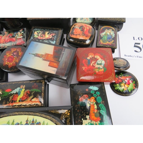 275 - Collection of thirty six Russian lacquer papier Mache boxes, hair slides, brooches, some signed. (36... 