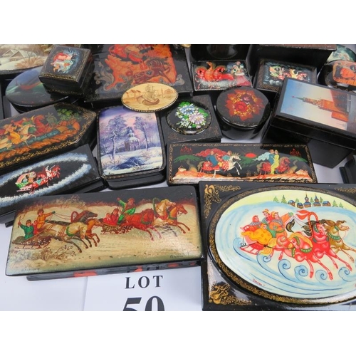 275 - Collection of thirty six Russian lacquer papier Mache boxes, hair slides, brooches, some signed. (36... 