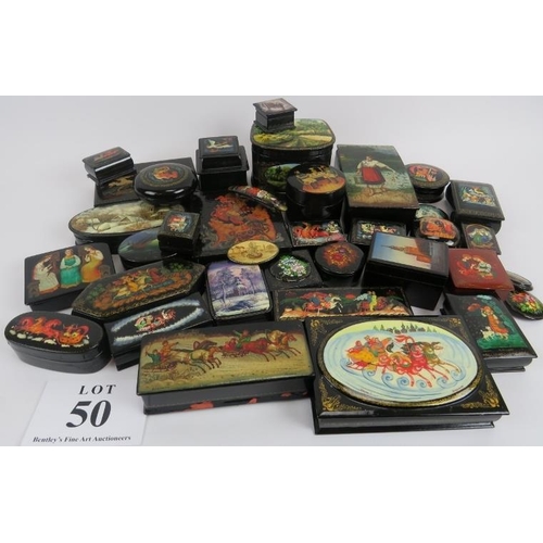 275 - Collection of thirty six Russian lacquer papier Mache boxes, hair slides, brooches, some signed. (36... 