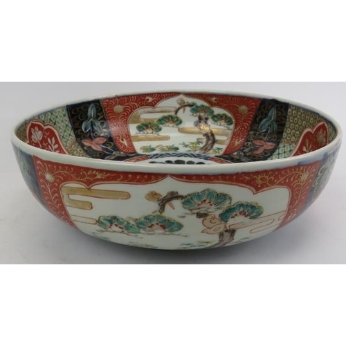 101 - A large Japanese Imari porcelain bowl, Meiji period (1868 - 1912). 12.4 in (31.5 cm) diameter. 
Cond... 