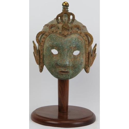 118 - A decorative Oriental bronze helmet, probably 20th century. Partially gilt with verdigris. 16.5 in (... 