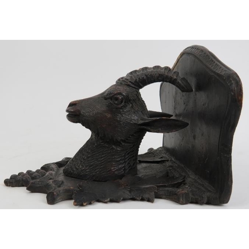 123 - A Black Forest carved wood wall bracket, 19th century. Carved depicting a goat enclosed by a grape a... 