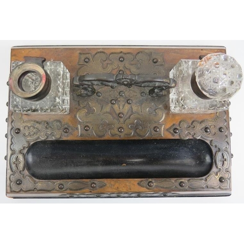 127 - A group of three writing desk items, 19th century. Comprising a writing slope with key, desktop inkw... 