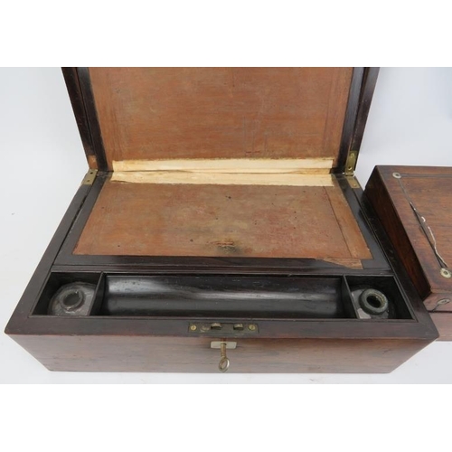 127 - A group of three writing desk items, 19th century. Comprising a writing slope with key, desktop inkw... 