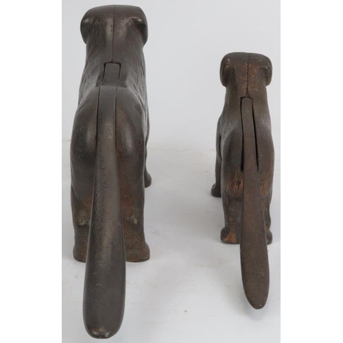 131 - Two vintage novelty cast iron nut crackers modelled as dog hounds. Both tails with leaver mechanism ... 