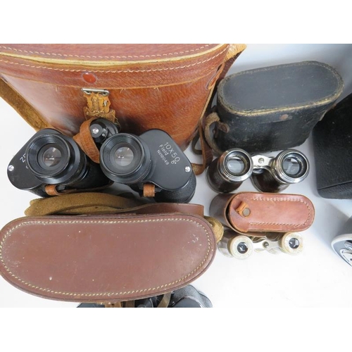 135 - A collection of binoculars and a film camera. (5 items) Condition report: Some wear with age. Bentle... 