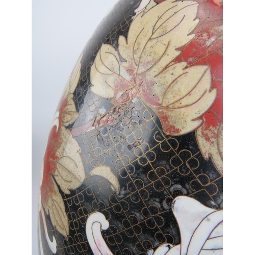 14 - A large Chinese cloisonné enamelled egg, 20th century. Decorated with an exotic bird amongst flowers... 