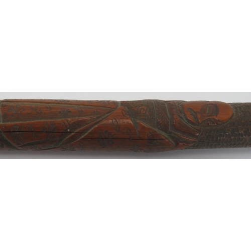 143 - A carved wood walking cane decorated with Japanese figures in a mountainous setting, late 19th/early... 