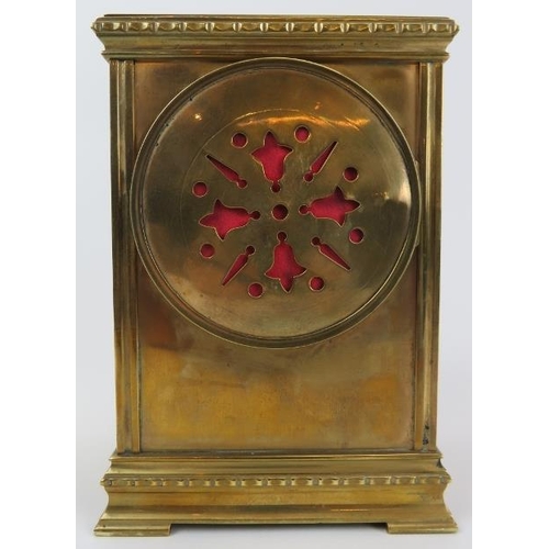 145 - An Edwardian brass cased mantle clock. The enamelled dial decorated with floral swags. Key included.... 