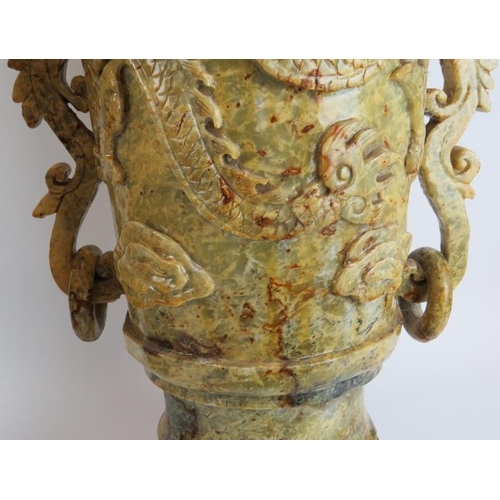 147 - A very large and impressive pair of Chinese carved stone vases and covers. Carved with Buddhistic li... 