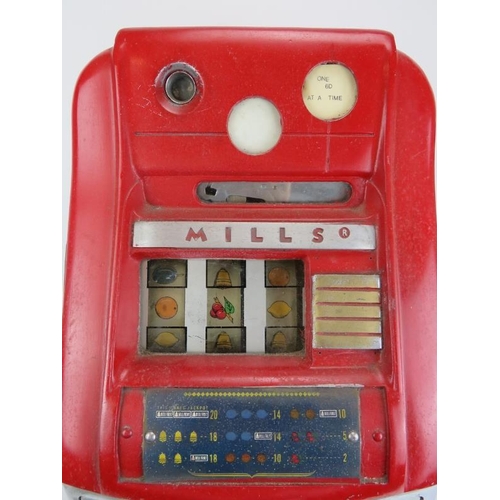 148 - An original vintage Mills three drum one arm bandit slot machine. Red enamelled and chrome mounts wi... 