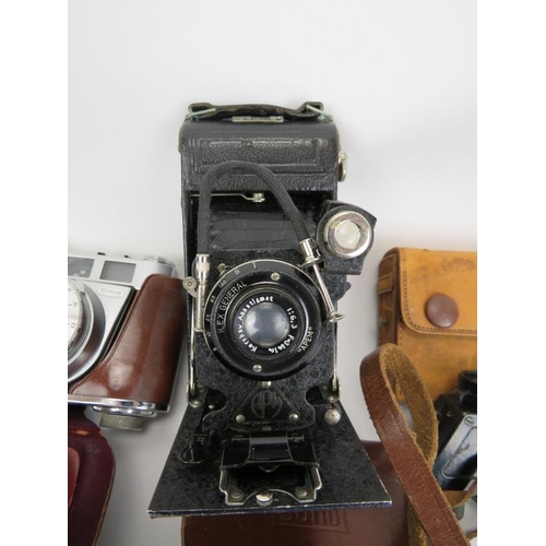 159 - A group of vintage cameras and binoculars. (5 items) Condition report: Some wear with age. Bentley’s... 