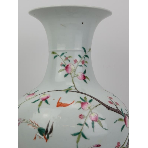 170 - A Chinese Famille rose vase, Republic period or earlier. Of meiping form with a tall flared neck. Ov... 