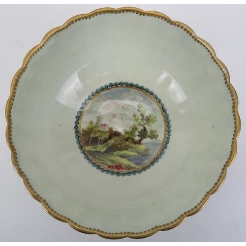 181 - An early Worcester porcelain bowl, 18th century. George III period. Decorated with a circular rural ... 