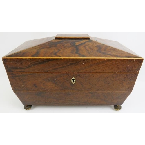 188 - A late Georgian rosewood tea caddy. Of sarcophagus form with twin handles, three internal compartmen... 