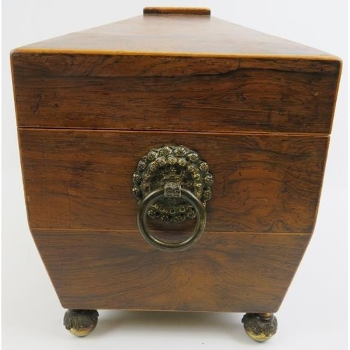 188 - A late Georgian rosewood tea caddy. Of sarcophagus form with twin handles, three internal compartmen... 