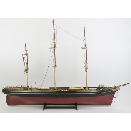 191 - Maritime: A vintage model of the Cutty Sark clipper ship. Hand crafted and painted wood. Molded plas... 