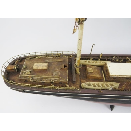 191 - Maritime: A vintage model of the Cutty Sark clipper ship. Hand crafted and painted wood. Molded plas... 