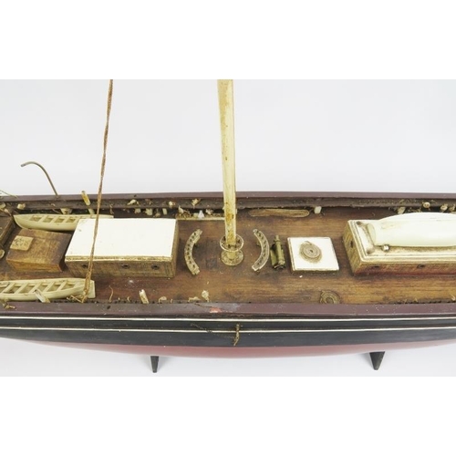 191 - Maritime: A vintage model of the Cutty Sark clipper ship. Hand crafted and painted wood. Molded plas... 