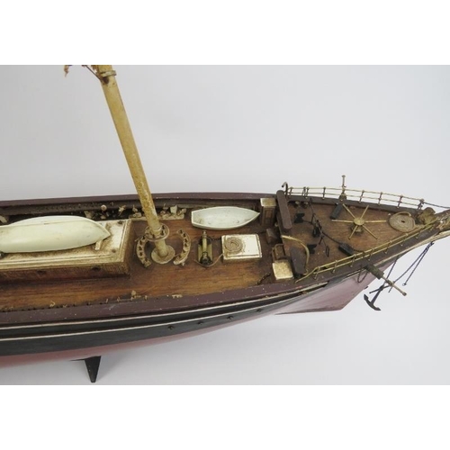 191 - Maritime: A vintage model of the Cutty Sark clipper ship. Hand crafted and painted wood. Molded plas... 