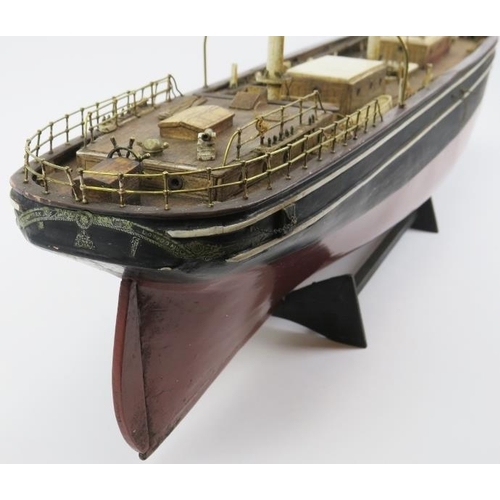 191 - Maritime: A vintage model of the Cutty Sark clipper ship. Hand crafted and painted wood. Molded plas... 