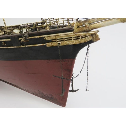 191 - Maritime: A vintage model of the Cutty Sark clipper ship. Hand crafted and painted wood. Molded plas... 